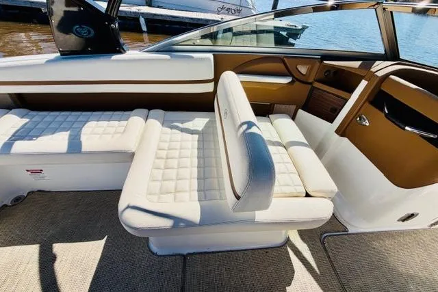 Slide: The Image of Interior of a 2017 Cobalt R7 boat with white quilted seating. - 11