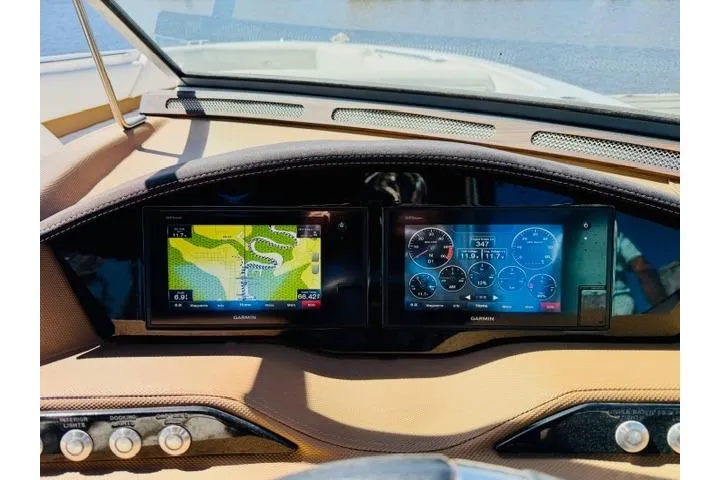 Slide: The Image of Dashboard of a 2017 Cobalt R7 boat with Garmin navigation displays. - 17