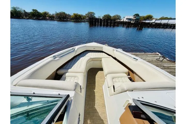 Slide: The Image of 2017 Cobalt R7 boat with spacious seating, docked by a calm river. - 19