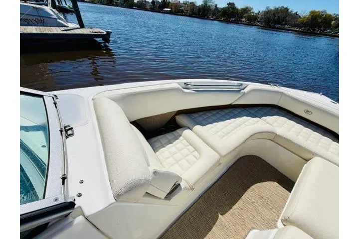 Slide: The Image of 2017 Cobalt R7 boat with white leather seating on a sunny lake. - 21