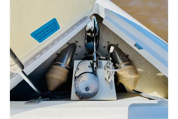 Slide: The Image of Anchor compartment of a 2017 Cobalt R7 boat with visible winch and ropes. - 22