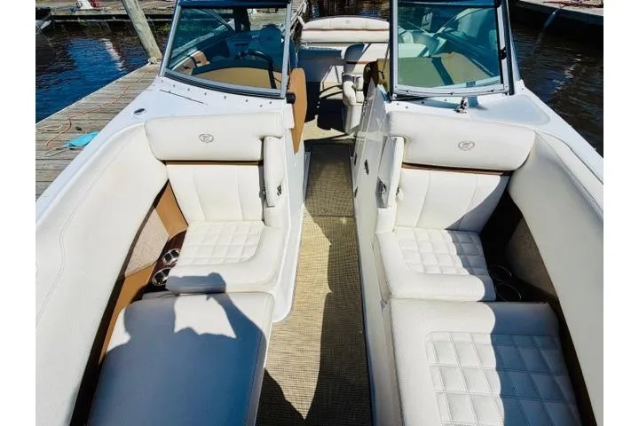 Slide: The Image of 2017 Cobalt R7 boat interior with white seating and open cockpit design. - 23