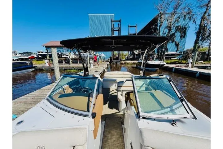 Slide: The Image of 2017 Cobalt R7 boat docked at marina under clear blue sky. - 24