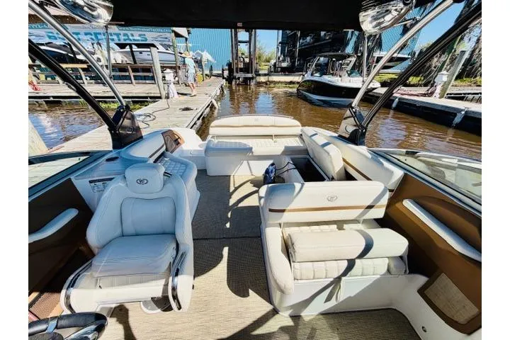 Slide: The Image of Luxurious 2017 Cobalt R7 boat interior with plush seating at a marina dock. - 25