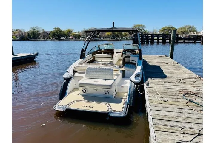 Slide: The Image of 2017 Cobalt R7 boat docked on a sunny day by the water. - 3