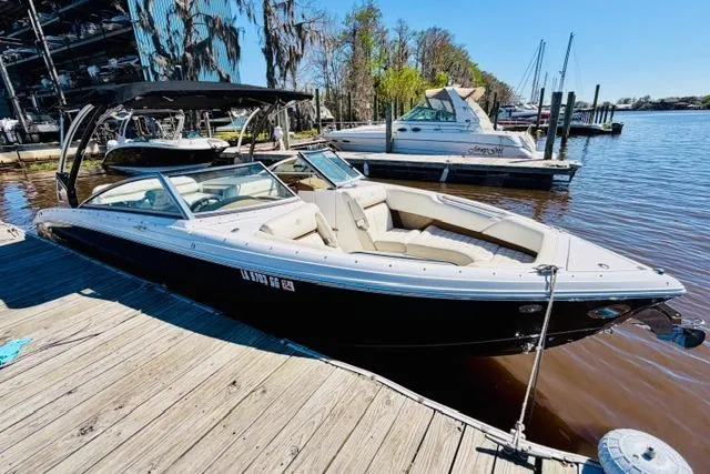 Slide: The Image of 2017 Cobalt R7 boat docked on a sunny day by the water. - 5
