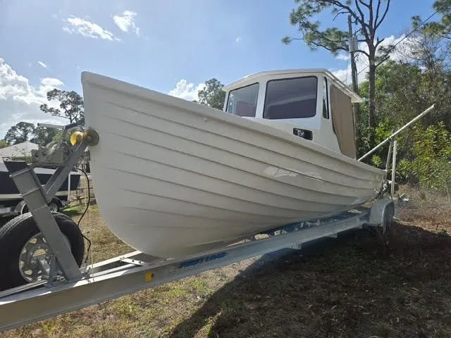 The Image of 2021 Custom Porter Lobster Boat on trailer outdoors. - 0