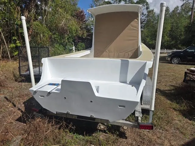 Slide: The Image of Custom Porter Lobster Boat 2021 parked on trailer outdoors. - 2