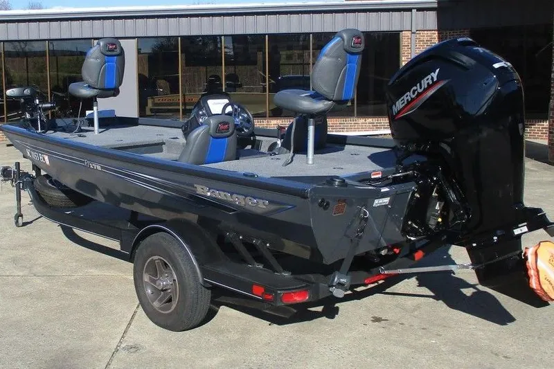 Slide: The Image of 2023 Ranger RT178 boat with Mercury engine, parked outdoors. - 3