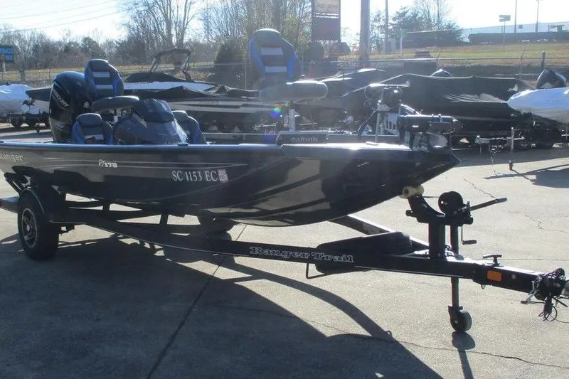Slide: The Image of 2023 Ranger RT178 fishing boat on trailer in outdoor setting. - 4
