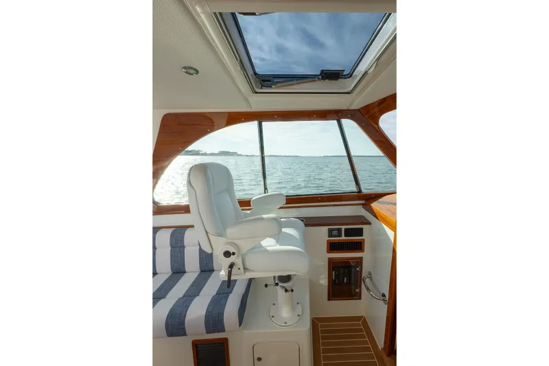 Slide: The Image of Luxurious interior of 2024 Hinckley 35 yacht with ocean view through skylight. - 24