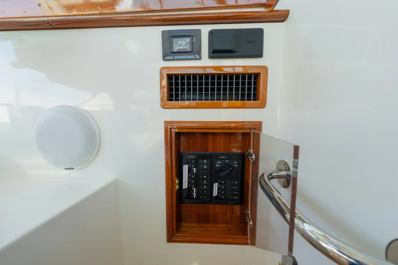 Slide: The Image of Control panel and speaker on 2024 Hinckley 35 yacht interior. - 25