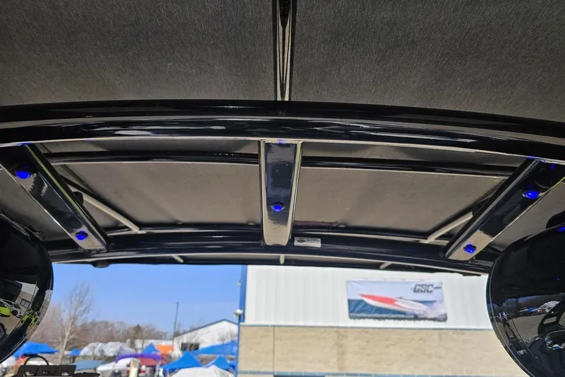 Slide: The Image of Interior view of 2017 Yamaha Boats 242X E-Series with sleek design and blue LED lights. - 100