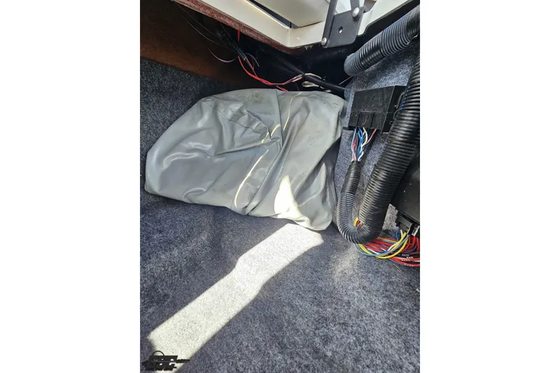 Slide: The Image of Interior view of a 2017 Yamaha Boats 242X E-Series showing wiring and components. - 104