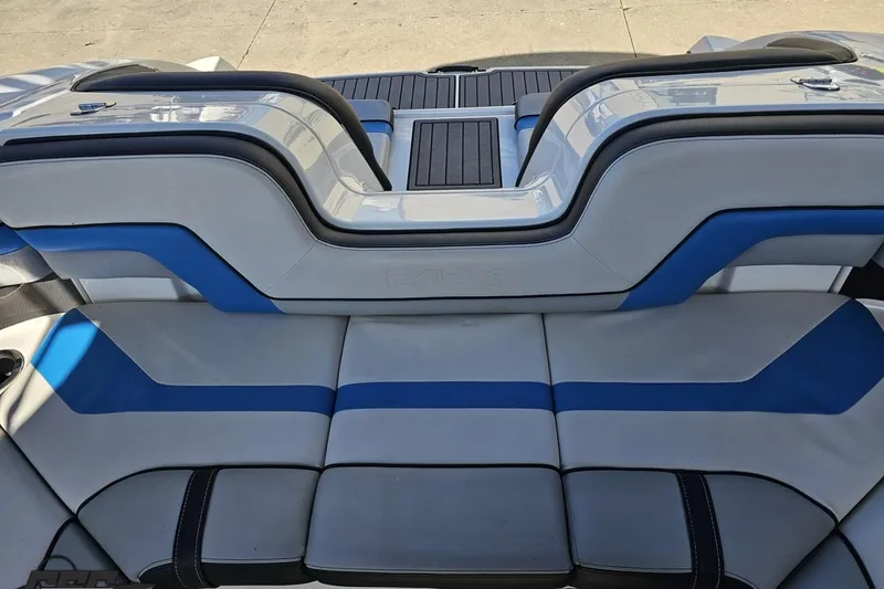 Slide: The Image of 2017 Yamaha Boats 242X E-Series interior seating with blue and gray upholstery. - 105