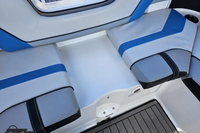 Slide: The Image of 2017 Yamaha Boats 242X E-Series interior seating with blue and gray upholstery. - 106