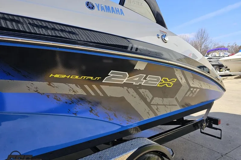 Slide: The Image of 2017 Yamaha Boats 242X E-Series, high output design, parked on trailer. - 21