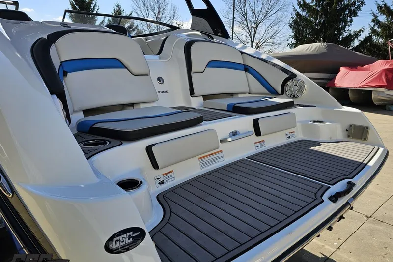 Slide: The Image of 2017 Yamaha Boats 242X E-Series rear seating and deck area with sleek design. - 29