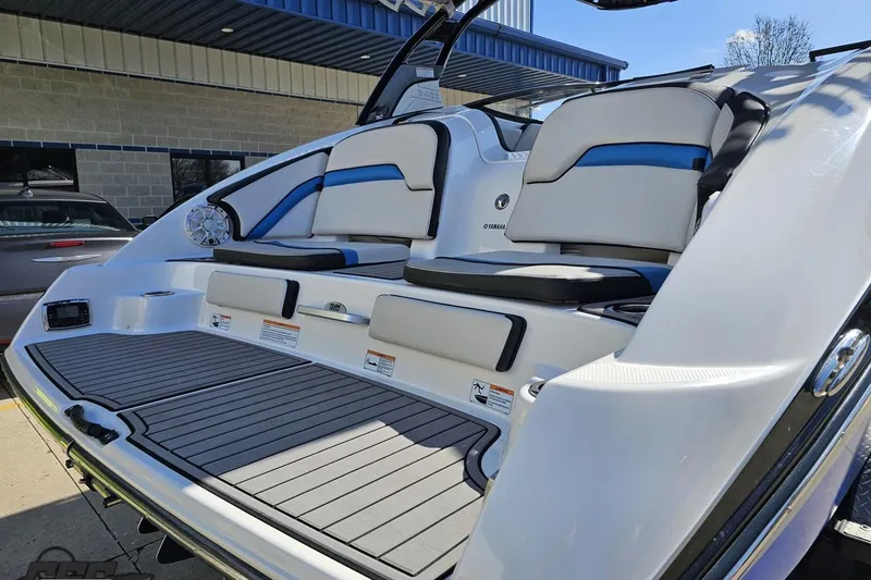 Slide: The Image of 2017 Yamaha Boats 242X E-Series swim platform with cushioned seating and sleek design. - 32