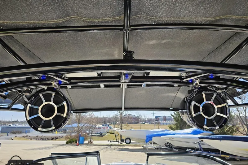 Slide: The Image of 2017 Yamaha Boats 242X E-Series with premium speakers and sleek canopy design. - 47