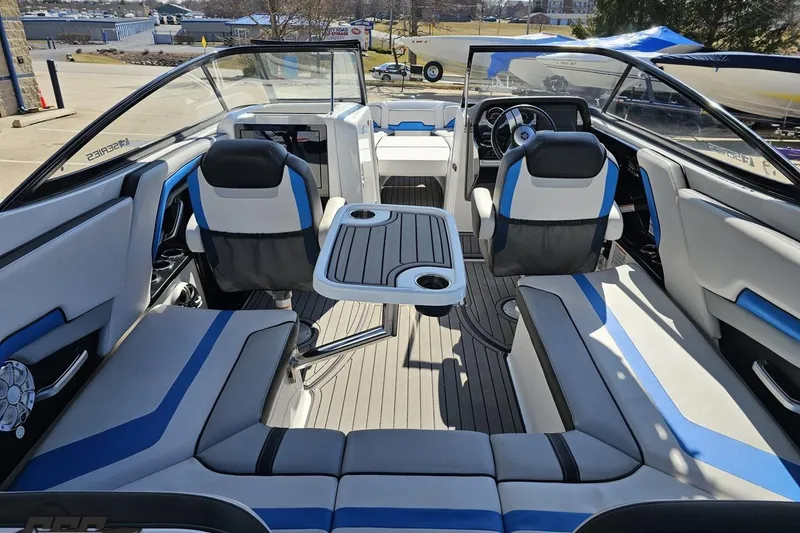 Slide: The Image of 2017 Yamaha Boats 242X E-Series interior with seating and table, showcasing modern design. - 50