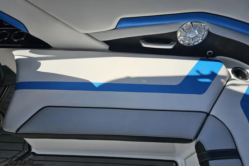 Slide: The Image of Interior seating of 2017 Yamaha Boats 242X E-Series with blue and white upholstery. - 54
