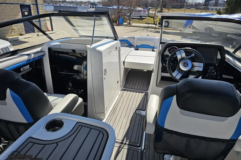Slide: The Image of 2017 Yamaha Boats 242X E-Series interior with steering wheel and seating. - 58
