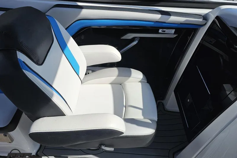 Slide: The Image of 2017 Yamaha Boats 242X E-Series interior seat with blue and white design. - 61