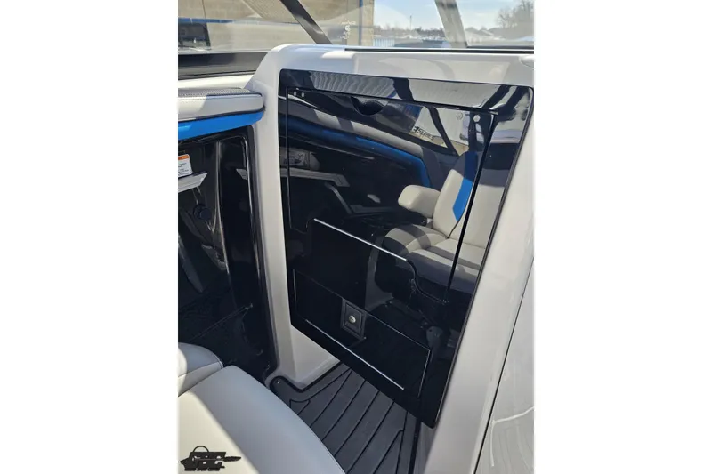 Slide: The Image of 2017 Yamaha Boats 242X E-Series interior with sleek black panel and seating. - 62