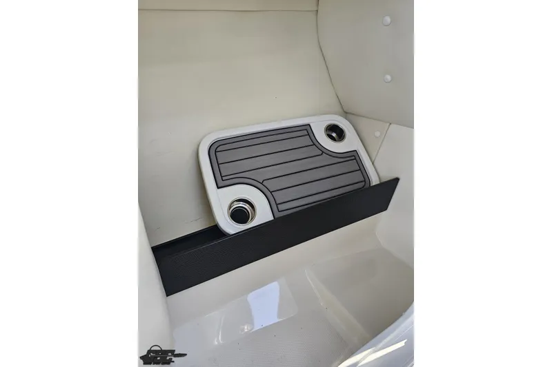 Slide: The Image of 2017 Yamaha Boats 242X E-Series interior with cup holders and sleek design. - 65