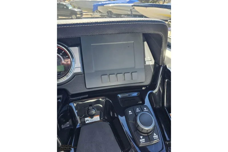 Slide: The Image of Dashboard of 2017 Yamaha Boats 242X E-Series with control panel and display screen. - 71