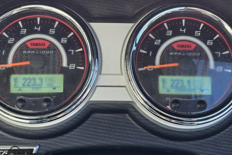 Slide: The Image of Dashboard of 2017 Yamaha Boats 242X E-Series showing RPM gauges and engine hours. - 74