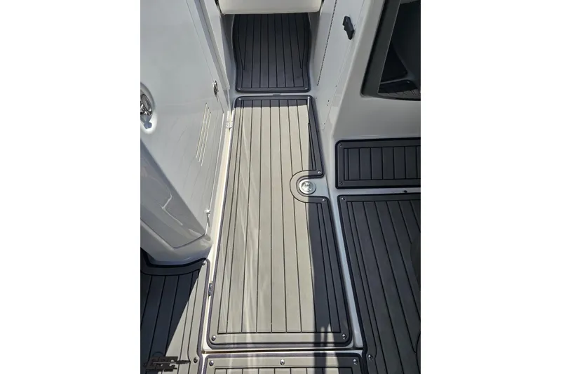 Slide: The Image of 2017 Yamaha Boats 242X E-Series deck with sleek, modern flooring design. - 75