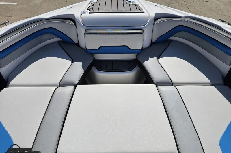 Slide: The Image of 2017 Yamaha Boats 242X E-Series interior seating with blue and gray accents. - 83
