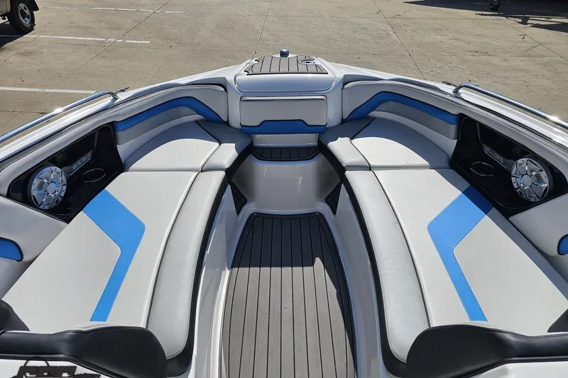 Slide: The Image of 2017 Yamaha Boats 242X E-Series interior with blue and gray seating, modern design. - 88