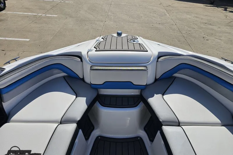 Slide: The Image of 2017 Yamaha Boats 242X E-Series interior with cushioned seating and sleek design. - 89