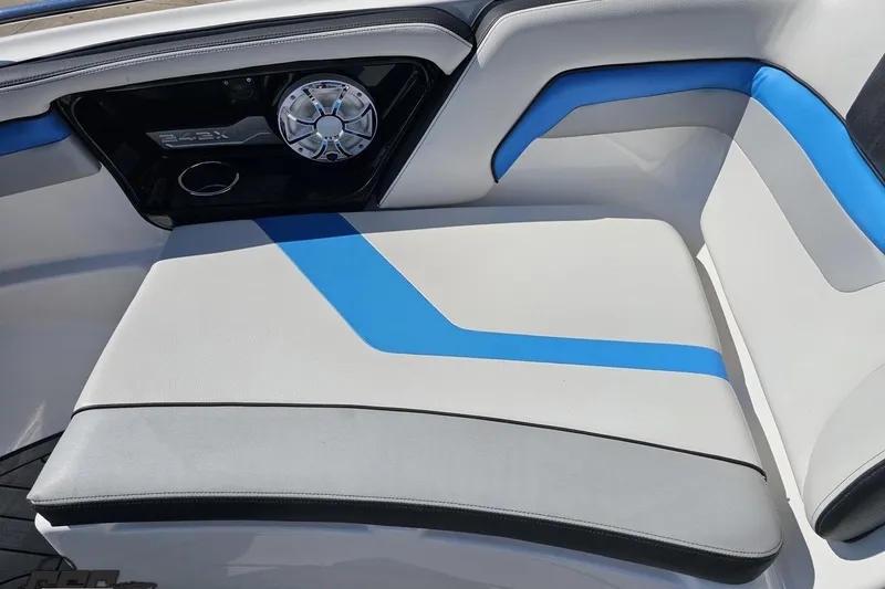 Slide: The Image of 2017 Yamaha Boats 242X E-Series interior seating with blue and gray accents. - 92