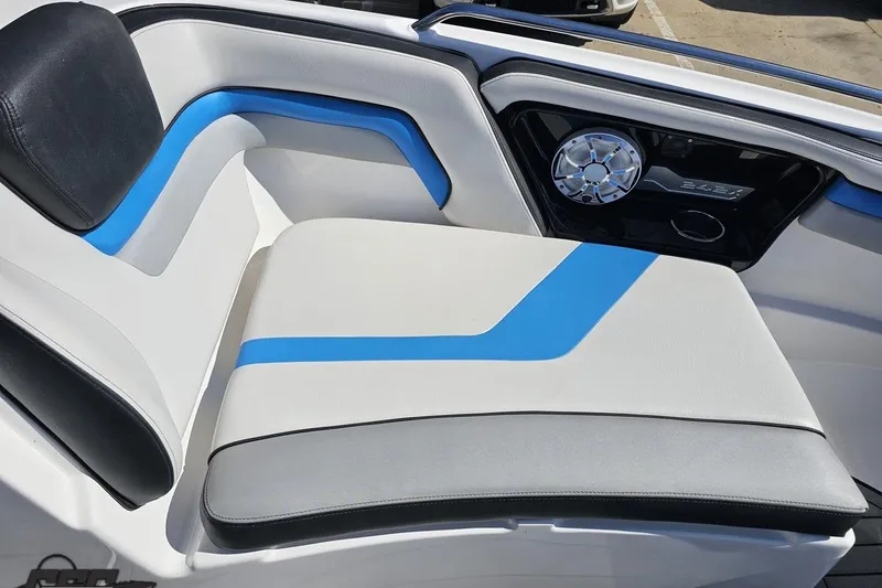 Slide: The Image of 2017 Yamaha Boats 242X E-Series interior with blue and white seating and speaker detail. - 94