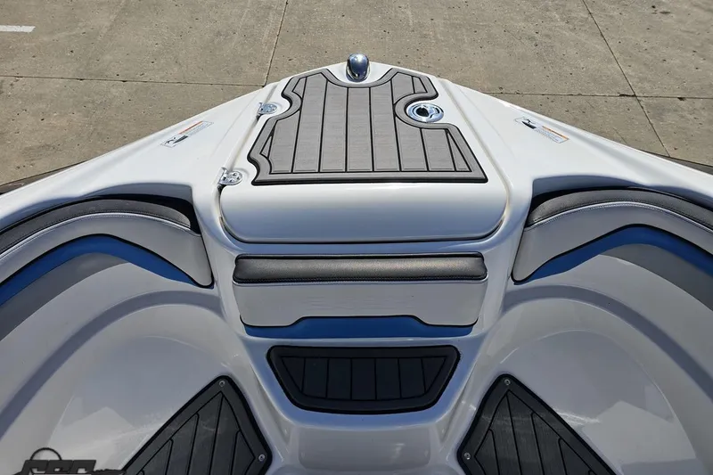 Slide: The Image of Bow seating area of 2017 Yamaha Boats 242X E-Series with sleek design and cushioned seats. - 96