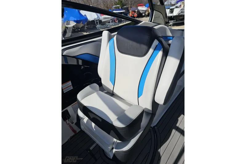 Slide: The Image of Captain's seat of 2017 Yamaha Boats 242X E-Series, featuring blue and gray accents. - 98