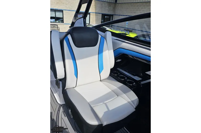Slide: The Image of 2017 Yamaha Boats 242X E-Series seat with blue and white upholstery. - 99