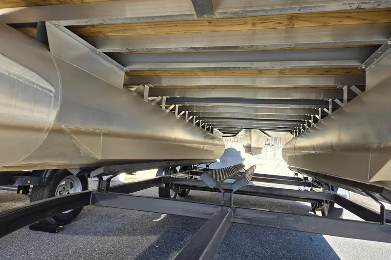 Slide: The Image of Underneath view of a 2010 Bennington 2275RLi pontoon boat on a trailer. - 3