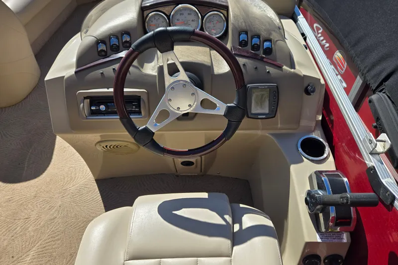 Slide: The Image of 2010 Bennington 2275RLi boat dashboard with steering wheel and control panel. - 8