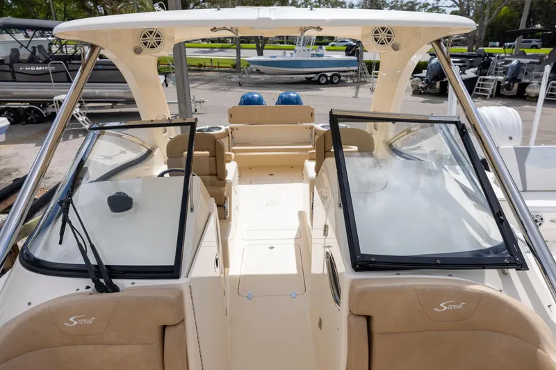 Slide: The Image of 2018 Scout 275 Dorado boat interior with dual consoles and open deck view. - 20