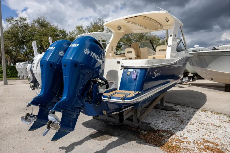 Slide: The Image of 2018 Scout 275 Dorado boat with dual Yamaha engines on display. - 4