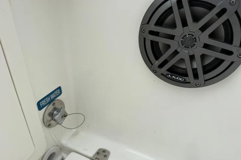 Slide: The Image of Freshwater access and JL Audio speaker on 2025 World Cat 235 TE boat. - 13