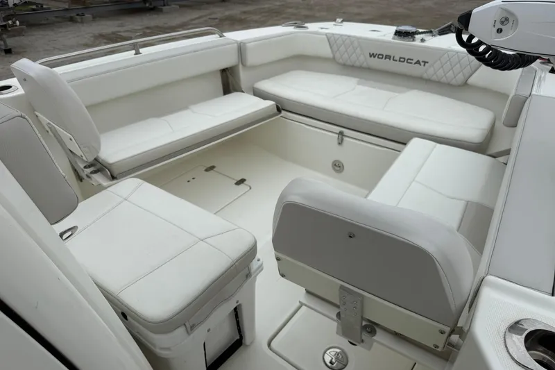 Slide: The Image of 2025 World Cat 235 TE boat interior with white seating and spacious layout. - 17