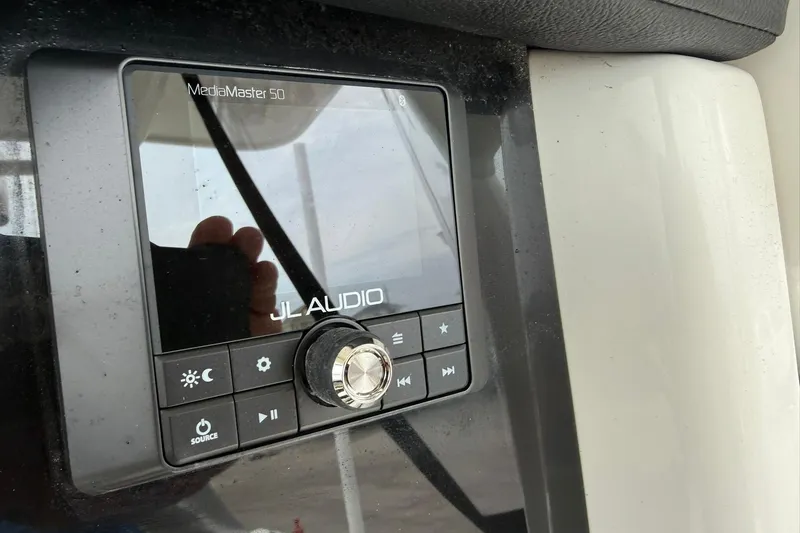 Slide: The Image of JL Audio MediaMaster 50 control panel on 2025 World Cat 235 TE boat. - 21