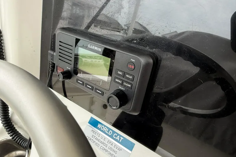 Slide: The Image of Garmin marine radio on 2025 World Cat 235 TE boat dashboard. - 23
