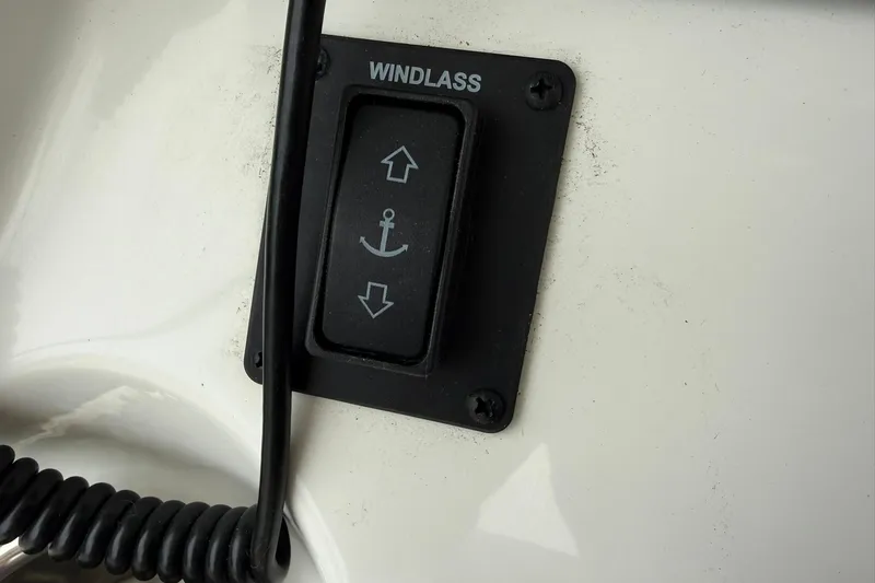 Slide: The Image of Windlass control switch on 2025 World Cat 235 TE boat dashboard. - 24